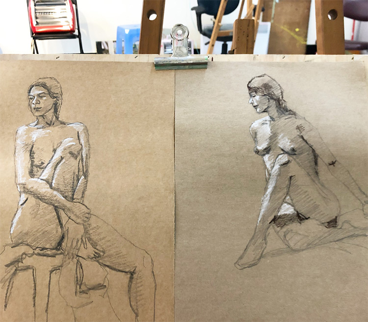 Figure drawing sketches on toned paper