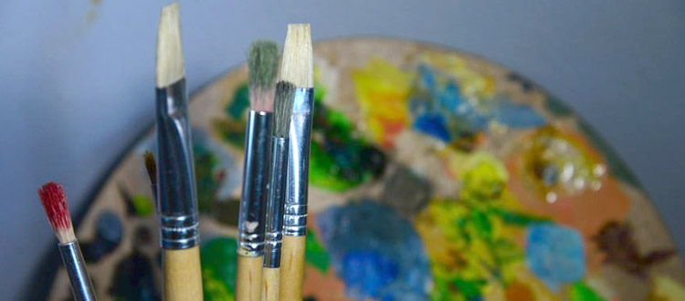 Paintbrushes and oil palette