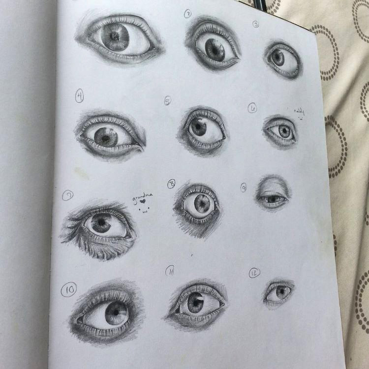 Full sketchbook page of human eyes