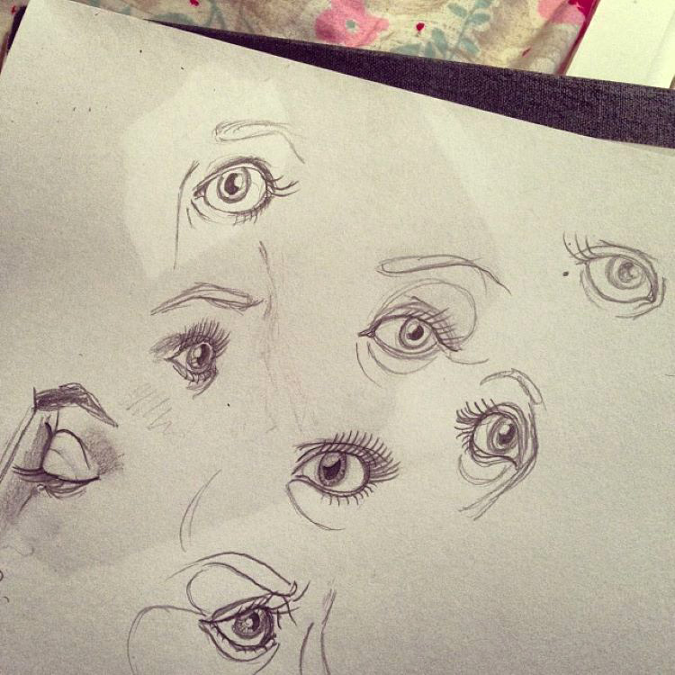 Eye drawings on toned paper