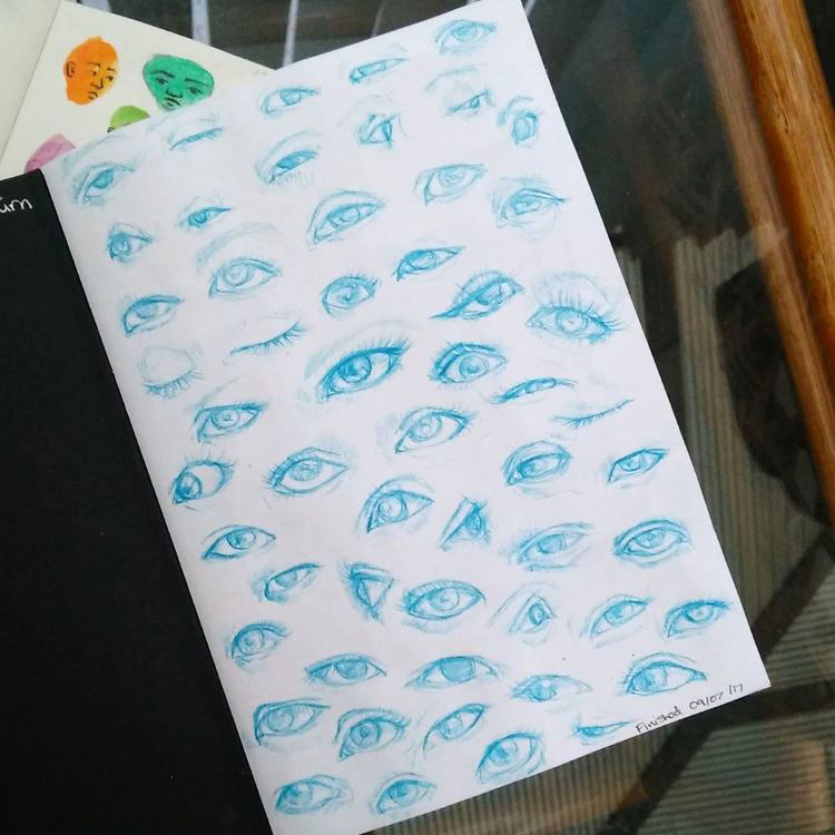 Blue graphite pencil eye drawings