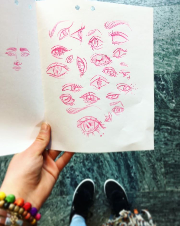 Red pencil sketches of eyes