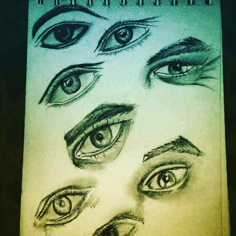 Vertical sketchbook drawing of eyes